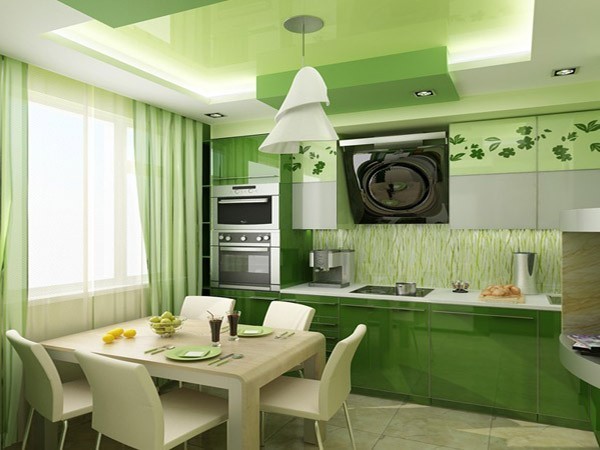 Cucina nei toni del verde: l'integrità degli interni completa la scelta di piatti e tende